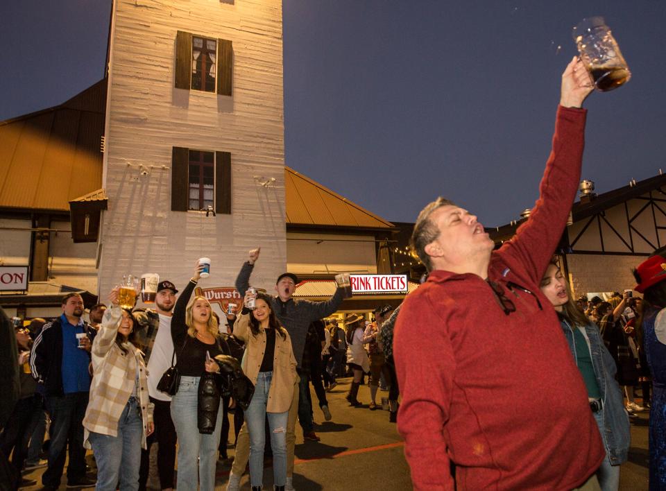 Roy Fredrick raises his glass for a toast during Wurstfest in New Braunfels on Nov. 5, 2021. The event is back for 2023.