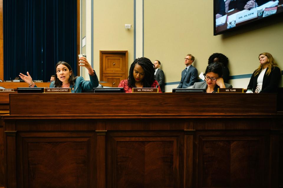 Ocasio-Cortez, left, Rep. Ayanna Pressley (D-MA), center, and Rep. Rashida Tlaib (D-MI), right, sit together at the Committee for Oversight and Reform. Ocasio-Cortez takes her turn to speak to a panel of witnesses at a hearing entitled  “Medical Experts: Inadequate Federal Approach to Opioid Treatment and the Need to Expand Care.”