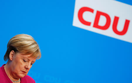 FILE PHOTO: German Chancellor Angela Merkel reacts as she attends a news conference following the Hesse state election in Berlin, Germany, October 29, 2018. REUTERS/Hannibal Hanschke/File Photo