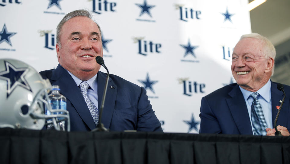 New Dallas Cowboys head coach Mike McCarthy, left, is introduced by team owner Jerry Jones, right, during a press conference at the Dallas Cowboys headquarters Wednesday, Jan. 8, 2020, in Frisco, Texas. (AP Photo/Brandon Wade)