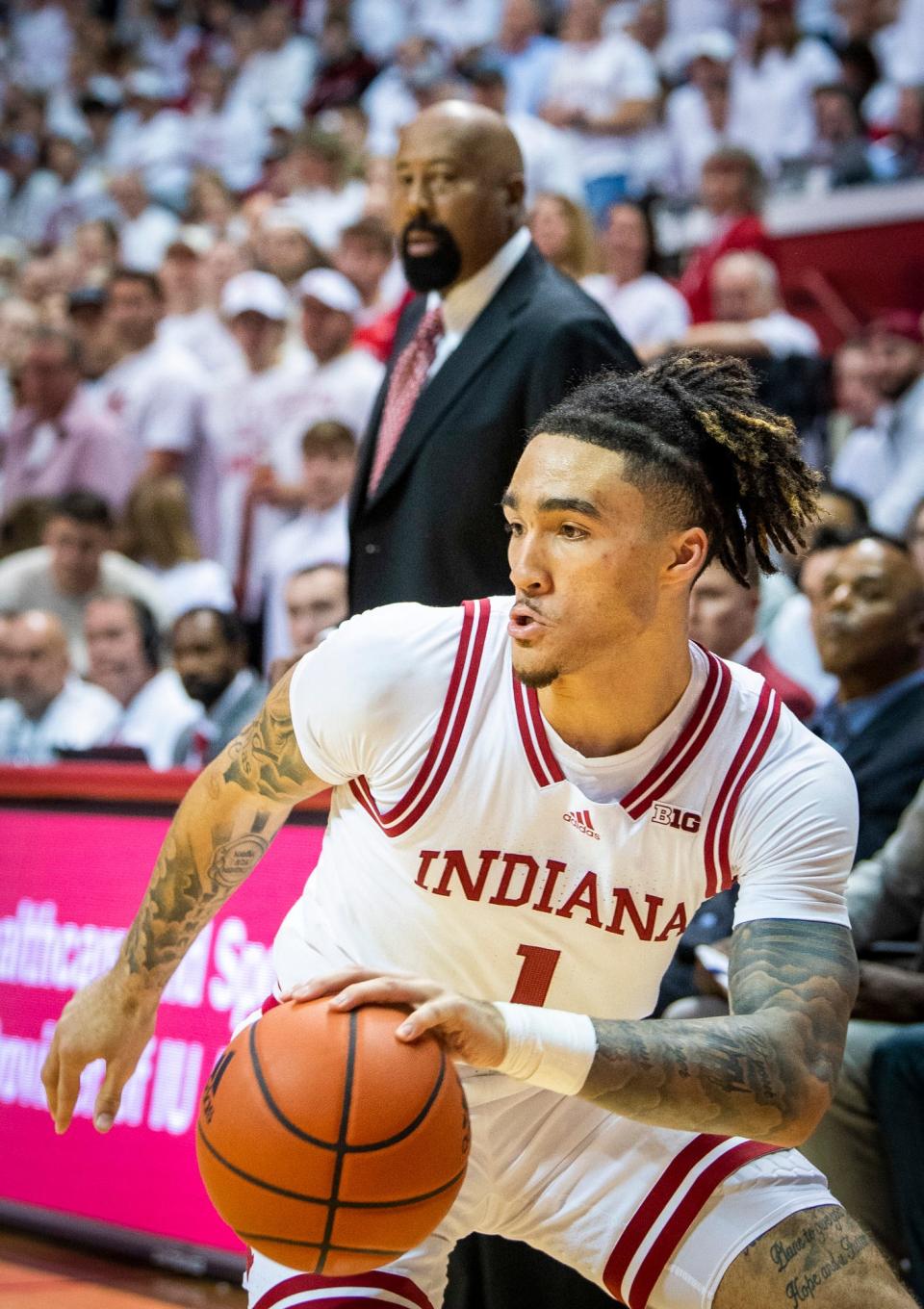 Indiana's Jalen Hood-Schifino (1) drives during a Nov. 30 game against North Carolina in Bloomington. Hood-Schifino might not play Saturday for the Hoosiers against Kansas in Lawrence.