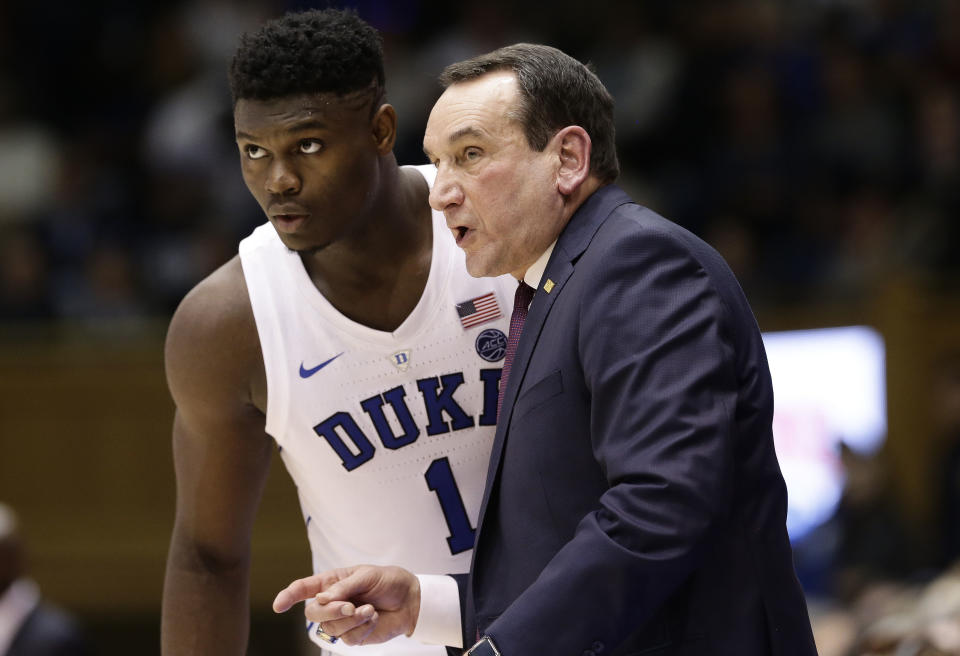 Duke's Zion Williamson (1) listens to coach Mike Krzyzewski during the first half of an NCAA college basketball game against Yale in Durham, N.C., Saturday, Dec. 8, 2018. (AP Photo/Gerry Broome)