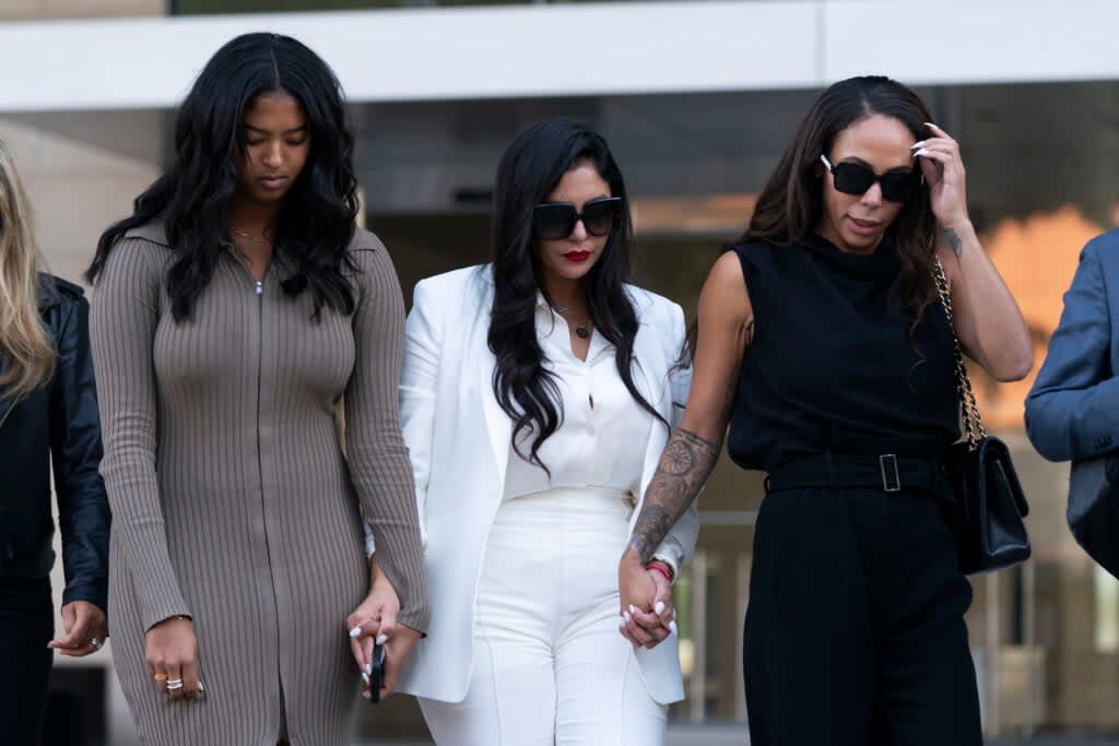 Vanessa Bryant, center, Kobe Bryant’s widow, leaves a federal courthouse on Aug. 24, 2022, in Los Angeles with her daughter, Natalia, left, and soccer player Sydney Leroux. (AP Photo/Jae C. Hong)