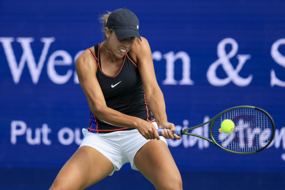 Madison Keys, of the United States, returns a shot to Petra Kvitova, of the Czech Republic, during the Western & Southern Open tennis tournament, Saturday, Aug. 20, 2022, in Mason, Ohio. (AP Photo/Aaron Doster)