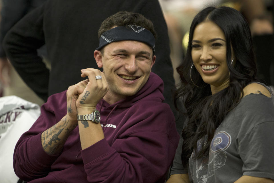 Former Cleveland Browns quarterback Johnny Manziel, shown here on Saturday at a Texas A&M basketball game with fiancee Bre Tiesi, said he’s sober and wants to play in the NFL again. (AP)