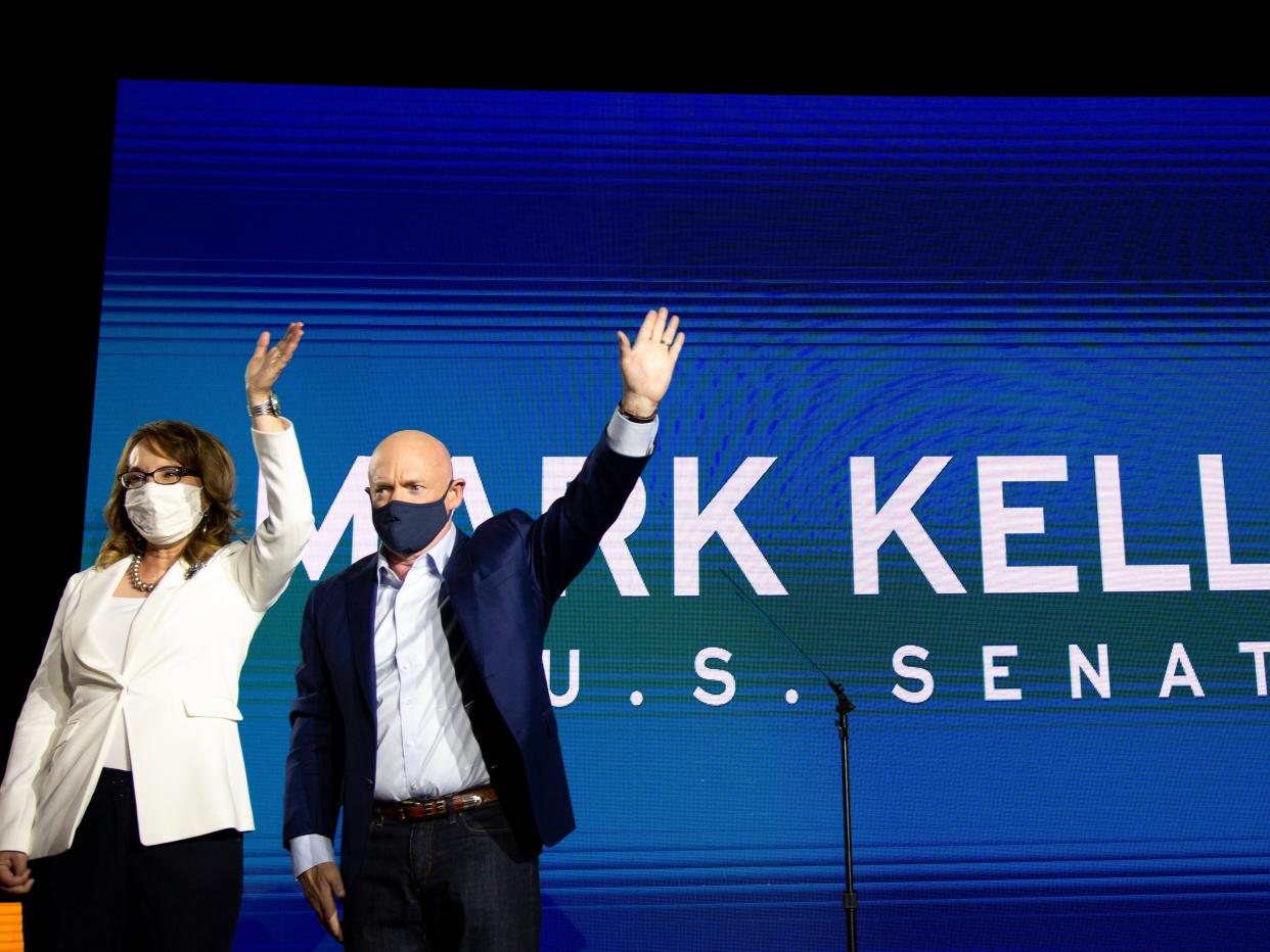 <p>Mark Kelly and Gabrielle Giffords on the night of his victory in Arizona</p> (Getty Images)