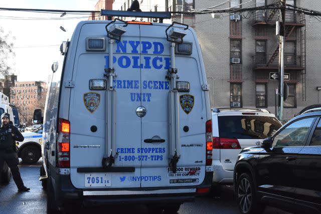 <p>Kyle Mazza/SOPA Images/Shutterstock</p> Police van seen at the scene of the children's death.