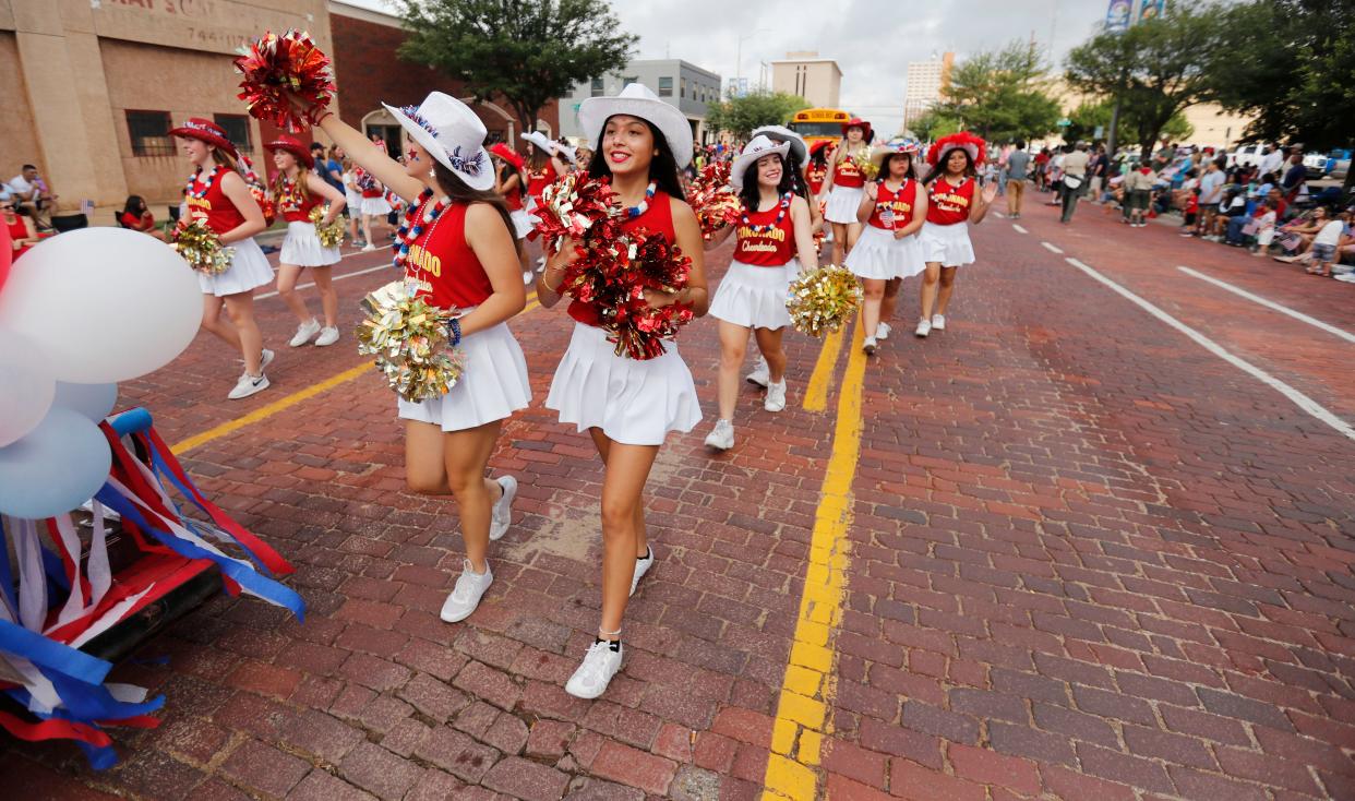 The Coronado High School Cheer Squad march in the 31st annual 4th on Broadway Independence Day parade and festival Saturday, July 3rd, 2021. (Mark Rogers/For A-J Media)