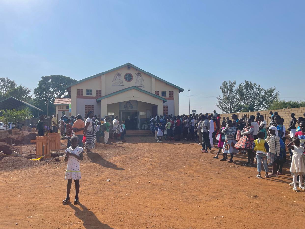 A crowd of Catholics waits for morning mass to begin at Saint Pantaleon church in Siaya, Kenya.