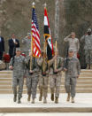 U.S. soldiers carry an Iraqi national flag and an U.S. flag during a ceremony to retire the flags, marking the end of the U.S. military engagement at the Baghdad Diplomatic Support Center December 15, 2011. The U.S military officially ended its war in Iraq on Thursday, packing up their military flag at a ceremony with U.S. Defense Secretary Leon Panetta nearly nine years after the invasion that ousted Saddam Hussein. REUTERS/Mohammed Ameen