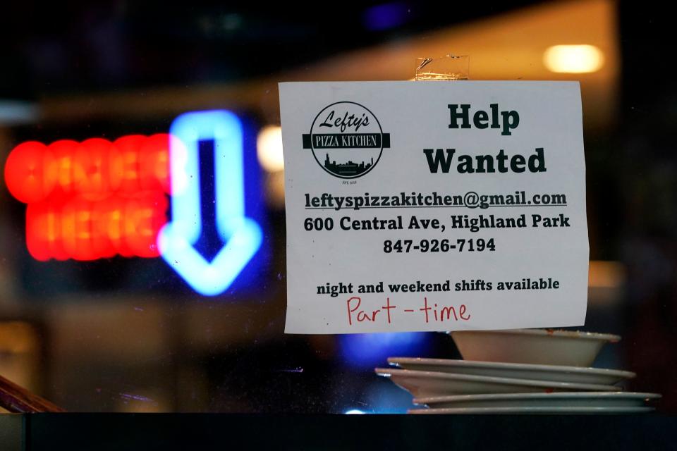 Hiring sign is displayed at a restaurant in Highland Park, Ill., Thursday, July 14, 2022. Fewer Americans filed for unemployment benefits last week as the labor market continues to shine despite weakening elements of the U.S. economy. Applications for jobless aid for the week ending Aug. 27, fell by 5,000 to 232,000, the Labor Department reported Thursday, Sept. 1.
