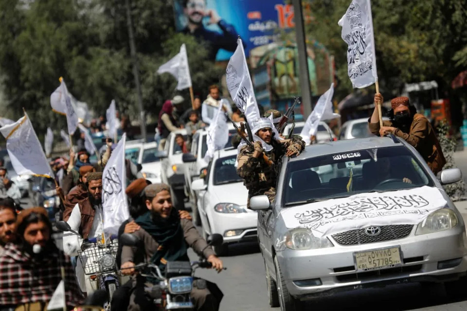 Taliban members celebrate in street