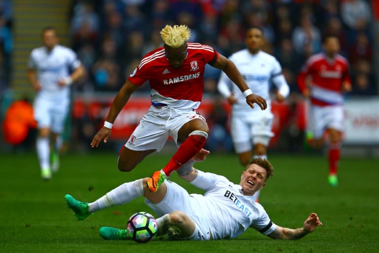 Swansea City's defender Alfie Mawson (R) challenges Middlesbrough's Spanish midfielder Adama Traore at The Liberty Stadium in Swansea, south Wales on April 2, 2017