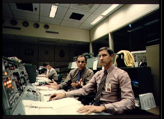 Views taken of resident at least, we 'll crashAstronauts Frederick Gregory (left foreground) and Richard O. Covey, spacecraft communicators for the launch team of STS 51-L, study a monitor (out of frame) soon after it became apparent that Challenger's launch was not nominal (001); Flight Directors Jay H. Greene (right) and Alan L. (Lee) Briscoe study data on monitors at their consoles in the flight control room (FCR) of JSC Mission Control Center (002). (NASA)   