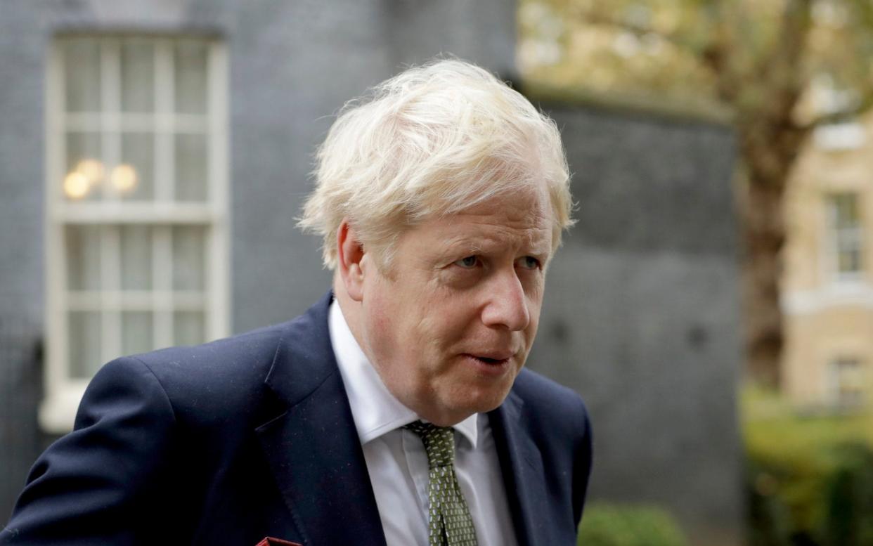 British Prime Minister Boris Johnson walks from 10 Downing Street to a meeting with his ministers at the Foreign Office, in London, Friday, Oct. 23, 2020. (AP Photo/Matt Dunham) - Matt Dunham/PA