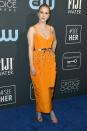 <p>Rachel Brosnahan shakes up a classic silhouette with this bold shade of orange.</p>