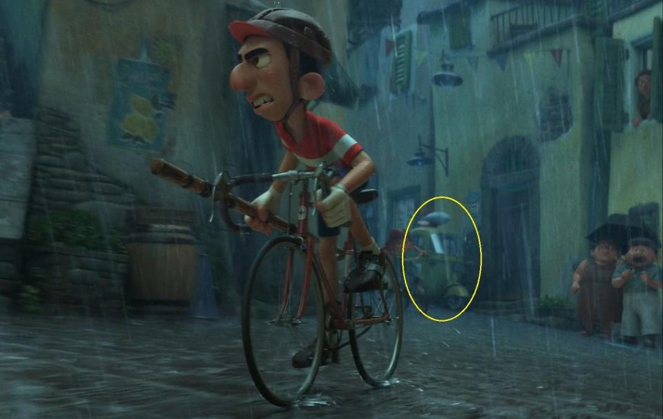 A man racing on a bike while it rains.