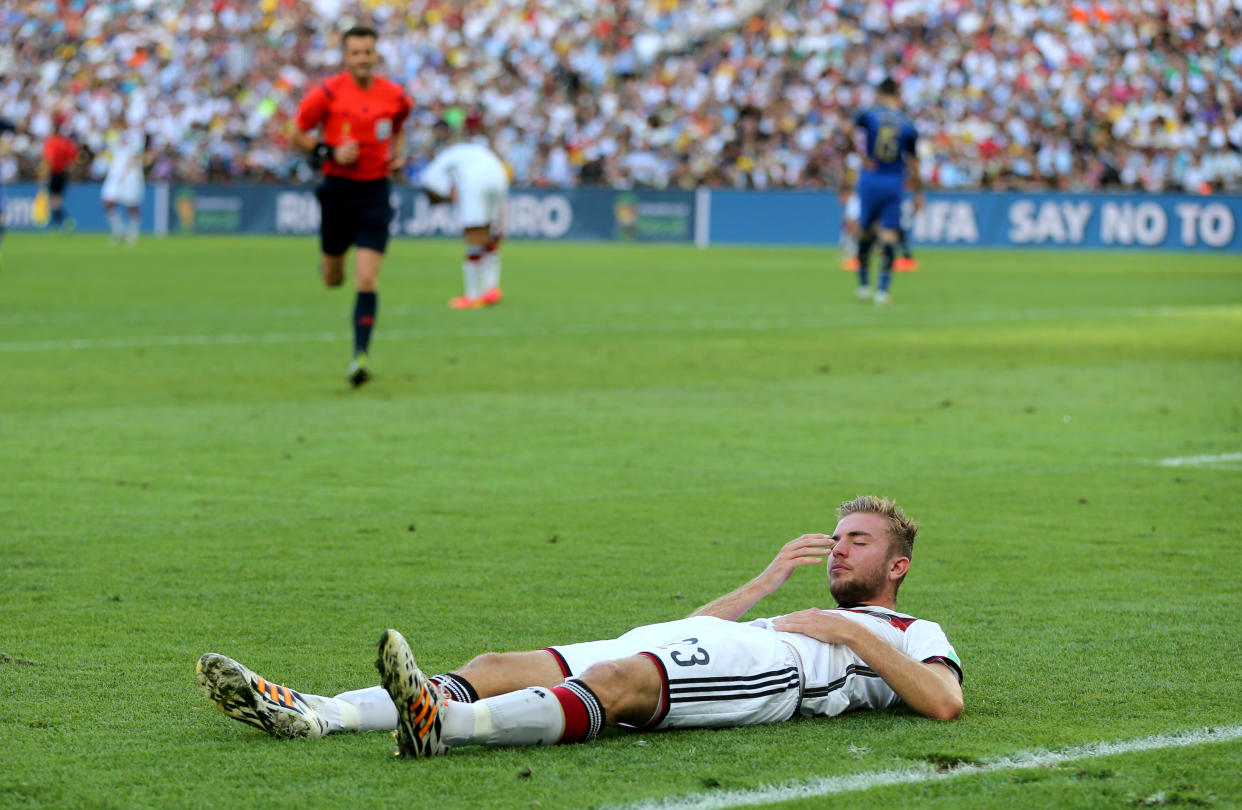 Germany Cristoph Kramer lies injured on the pitch after suffering a head injury