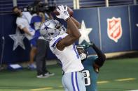 Dallas Cowboys wide receiver Michael Gallup (13) catches a touchdown pass as Philadelphia Eagles cornerback Michael Jacquet (38) defends in the first half of an NFL football game in Arlington, Texas, Sunday, Dec. 27. 2020. (AP Photo/Michael Ainsworth)