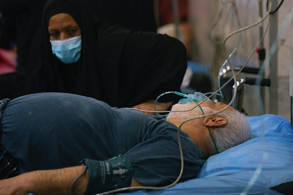 People with breathing problems are treated at a hospital during a sandstorm in Baghdad, Iraq, Monday, May 23, 2022. (AP Photo/Hadi Mizban)