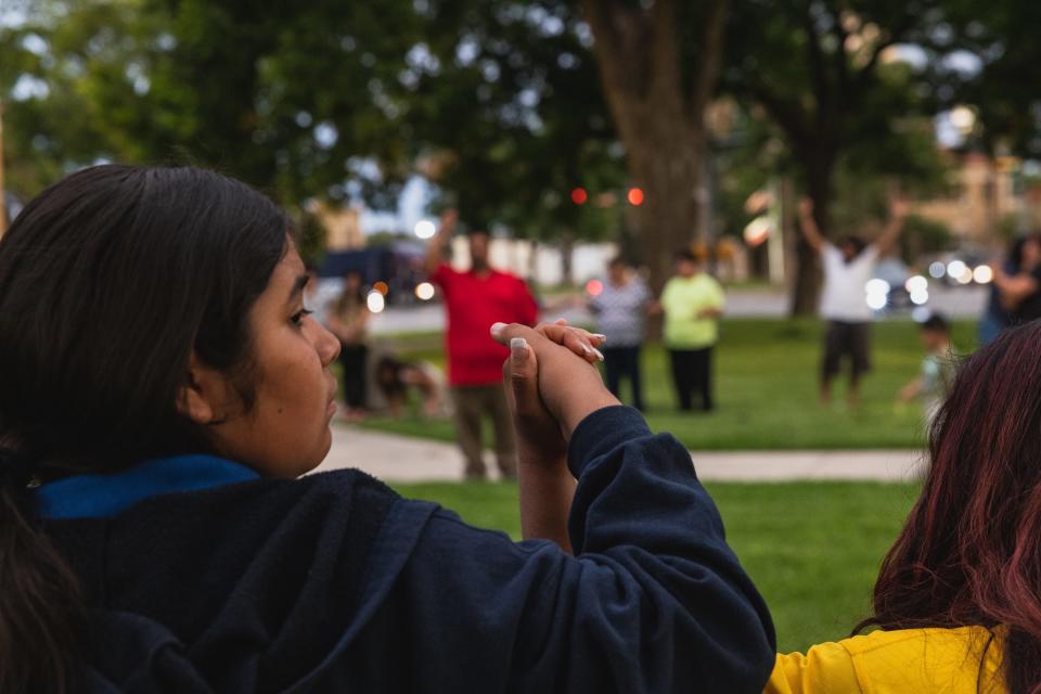 Members of the community gather at the City of Uvalde Town Square for a prayer vigil in the wake of a mass shooting at Robb Elementary School on May 24, 2022 in Uvalde, Texas.