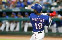 May 23, 2018; Arlington, TX, USA; Texas Rangers shortstop Jurickson Profar (19) follows through on a three run double in the sixth inning against the New York Yankees at Globe Life Park in Arlington. Mandatory Credit: Ray Carlin-USA TODAY Sports