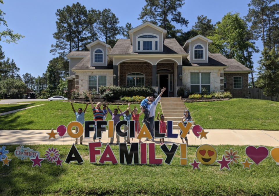 The neighborhood helped the Bonura family celebrate the finalization of the adoptions by holding a car parade.  / Credit: The Bonura Family