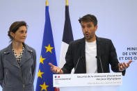 French Sports Minister Amelie Oudea-Castera, watches head of Paris 2024 Olympics Tony Estanguet delivering a speech during a meeting on the Paris 2024 Olympics opening ceremony, Tuesday, May 23, 2023 in Paris. French security experts have expressed misgivings about size and complexity of the security operation that will be needed to safeguard Paris' ambitions for the unprecedented opening gala along the River Seine. (AP Photo/Michel Euler)