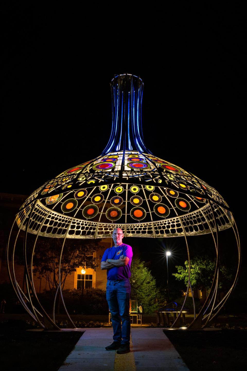 Brook Forrest White Jr. stands in front of a memorial to Stephen Powell at Centre College.