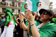 Demonstrators carry national flags and chant slogans during an anti-government protest in Algiers, Algeria May 17, 2019. REUTERS/Ramzi Boudina