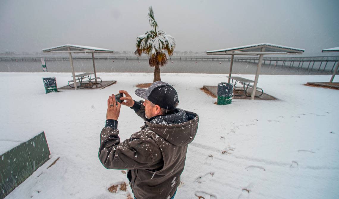 Chad Wallen took pictures of a snow covered Granby City Beach Jan. 10, 2021. The palm tree that has been a feature of the park has since died after the extended freeze a month later.