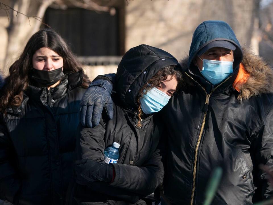 About 100 people gathered at the corner of Rivard and Roy streets to honour 17-year-old Amir Benayad, who was shot and killed there Thursday evening. (Ivanoh Demers/Radio-Canada - image credit)