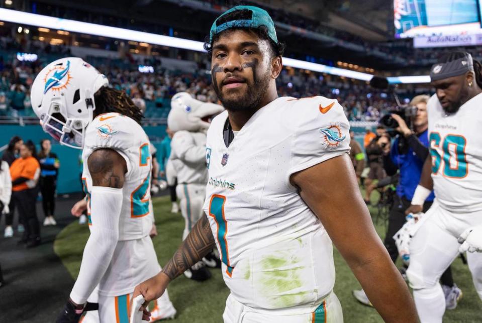 Miami Dolphins quarterback Tua Tagovailoa (1) walks off the field after losing his NFL game against the Buffalo Bills at Hard Rock Stadium on Sunday, Jan. 7, 2023, in Miami Gardens Fla. MATIAS J. OCNER/mocner@miamiherald.com