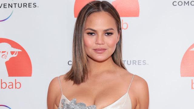 Chrissy Teigen glows as she shares candid topless snap using