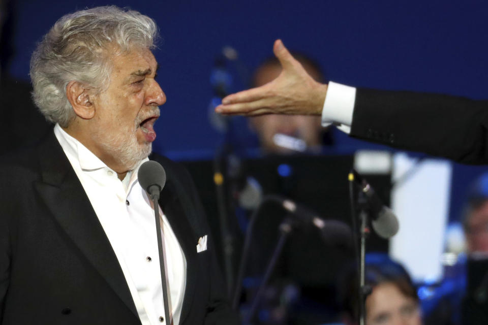 FILE - In this Wednesday, Aug. 28, 2019 file photo, opera star Placido Domingo performs during a concert in Szeged, Hungary. Domingo continued his calendar of European engagements despite allegations of sexual harassment, appearing here for a performance to inaugurate a sports complex for a local Catholic diocese. Two investigations into Domingo's behavior were opened in 2019 after Associated Press stories in which more than 20 women said the legendary tenor had pressured them into sexual relationships, behaved inappropriately and sometimes professionally punished those who rebuffed him. Dozens of others told the AP that they had witnessed his behavior. (AP Photo/Laszlo Balogh)