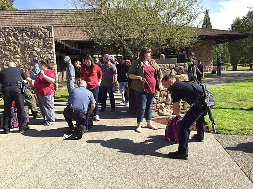 Police search students outside Umpqua Community College in Roseburg, Ore., Thursday, Oct. 1, 2015, following a deadly shooting at the southwestern Oregon community college.&nbsp;