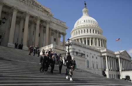 U.S. President Donald Trump and Speaker of the House Paul Ryan (R-WI) walk with Irish Taoiseach (Prime Minister) Enda Kenny after attending a Friends of Ireland reception on Capitol Hill in Washington, U.S., March 16, 2017. REUTERS/Joshua Roberts