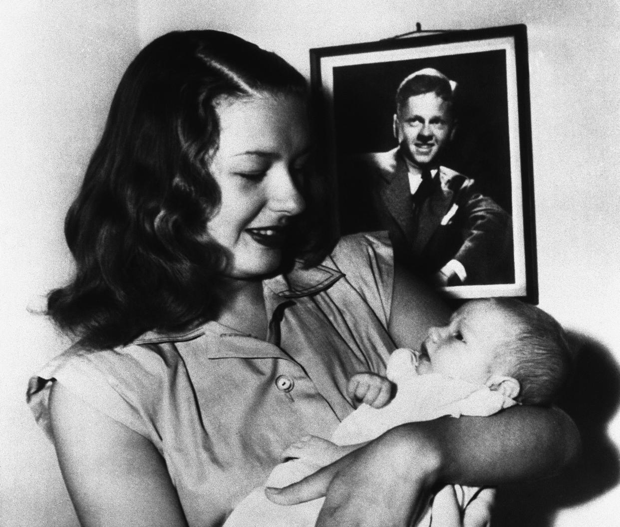 Mrs. Mickey Rooney, Betty Jane Rase, holds Mickey Rooney Jr., the youngster weighed 7lbs 5ozs at birth on August 3, 1945. Father Mickey Rooney was serving the European Theatre of operations at the time. 