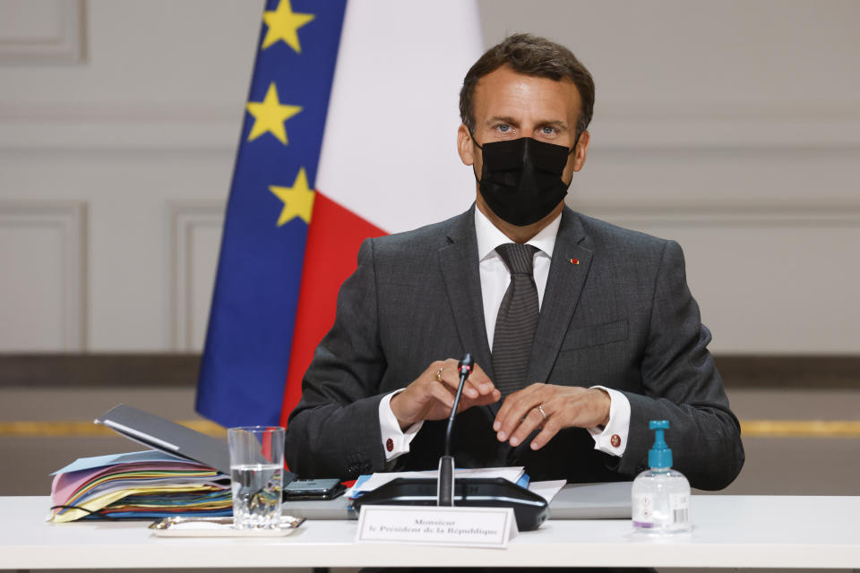 French President Emmanuel Macron chairs the weekly Cabinet meeting at the Elysee presidential palace in Paris, Wednesday June 9, 2021. Bubbling beneath France’s political landscape is an assortment of ultra-right groups, a subculture that shot to the nation’s attention when a young man slapped Macron and blurted out a centuries-old royalist cry. (Ludovic Marin/Pool Photo via AP)
