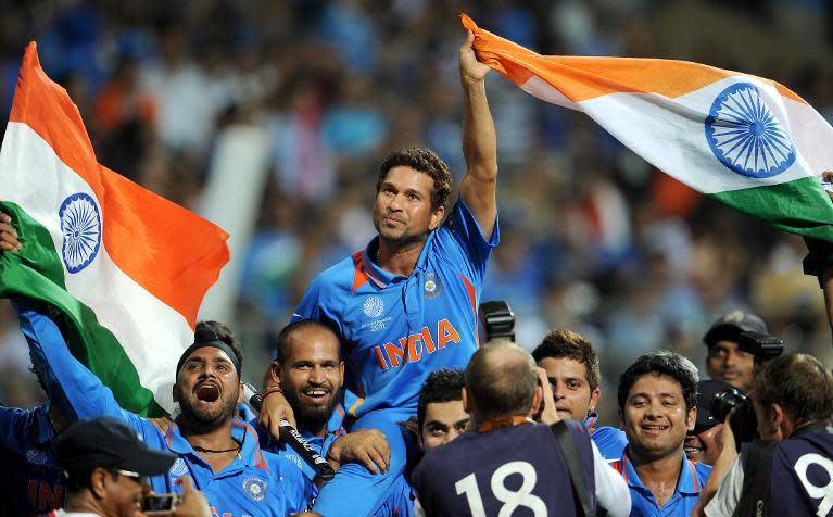 In this photograph taken on April 2, 2011, Sachin Tendulkar is carried by his teammates after he helped India defeat Sri Lanka in the Cricket World Cup final played at The Wankhede Stadium in Mumbai