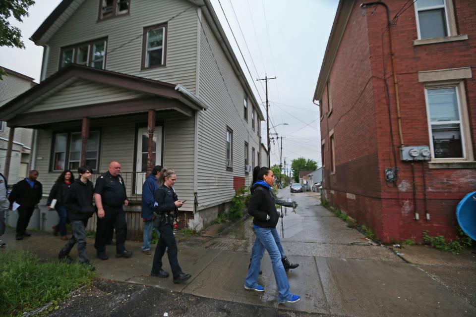 Community faith leaders and Milwaukee police officers take to the streets on the south side for a walk and patrol with hopes of interacting with area residents on June 8 as part of their conflict mediation efforts.