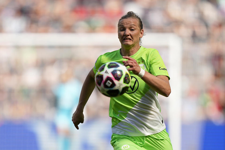 FILE - Wolfsburg's Alexandra Popp runs with the ball during the Women's Champions League final soccer match between FC Barcelona and VfL Wolfsburg at the PSV Stadion in Eindhoven, Netherlands, Saturday, June 3, 2023. (AP Photo/Martin Meissner, File)