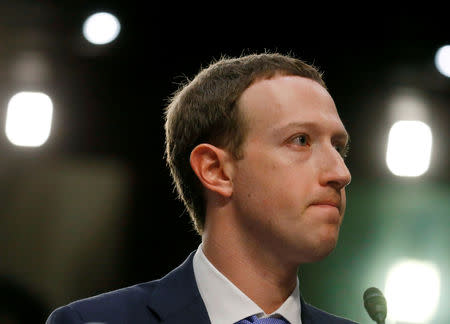 FILE PHOTO: Facebook CEO Mark Zuckerberg listens while testifying before a joint Senate Judiciary and Commerce Committees hearing regarding the company’s use and protection of user data, on Capitol Hill in Washington, U.S., April 10, 2018. REUTERS/Leah Millis