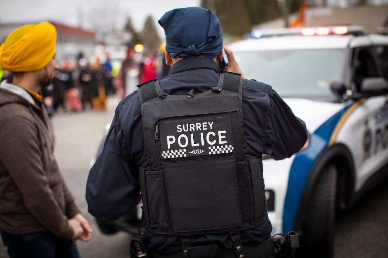 The union for Surrey Police Service officers says the most recent hires are not being paid by the city. (Ben Nelms/CBC - image credit)