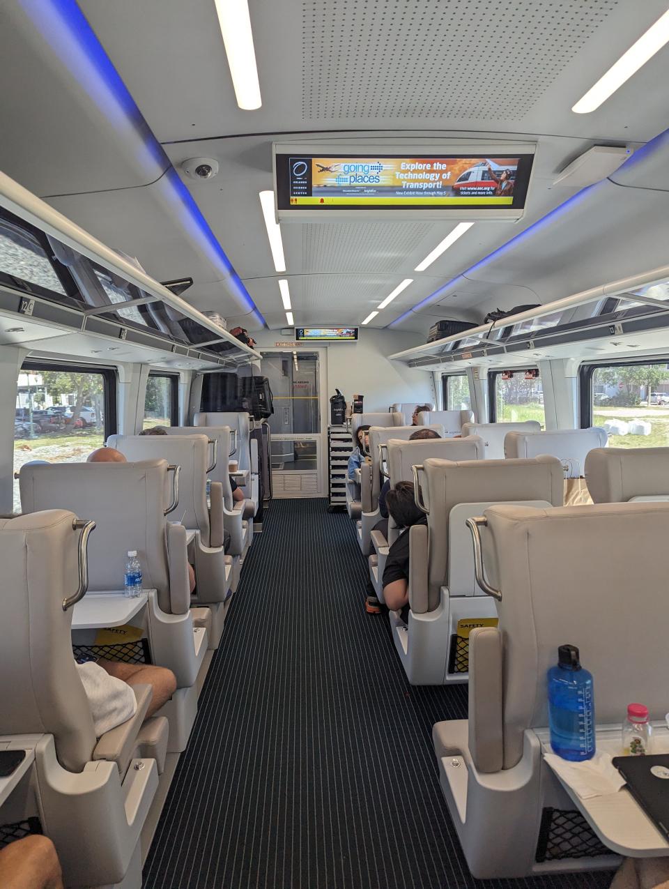 The inside of a brightline train car is shown.