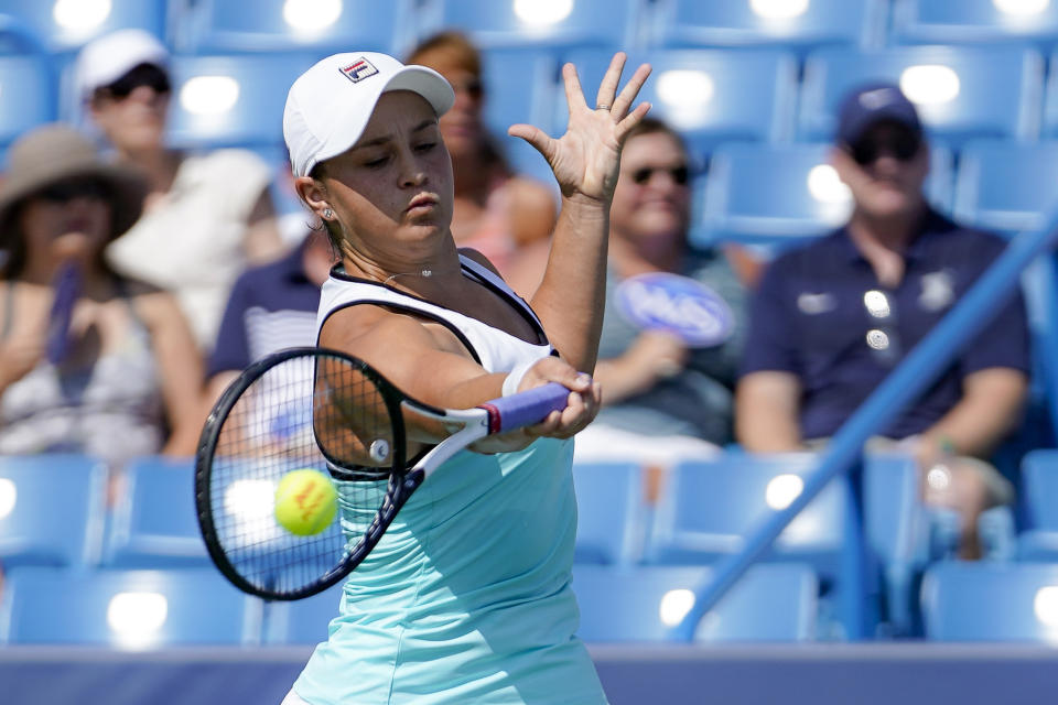 FILE - In this Aug. 17, 2019, file photo, Ashleigh Barty, of Australia, returns to Svetlana Kuznetsova, of Russia, during the Western & Southern Open tennis tournament in Mason, Ohio. Barty heads into the U.S. Open ranked No. 2 and in search of her first quarterfinal berth there. (AP Photo/John Minchillo, File)