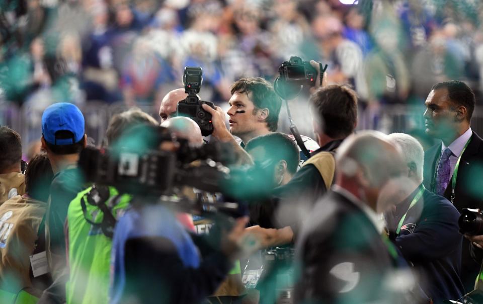 <p>Quarterback Tom Brady leaves the field after losing Super Bowl LII to the Philadelphia Eagles at US Bank Stadium in Minneapolis, Minnesota, on February 4, 2018. (TIMOTHY A. CLARY/AFP/Getty Images) </p>