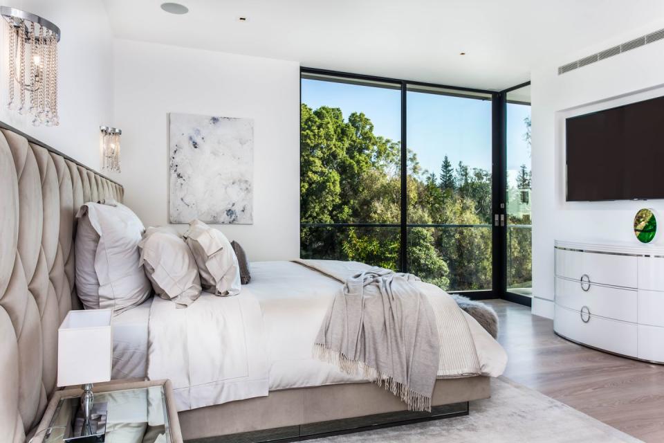 Another Bedroom Boasts a Glamorous, Modern Design.