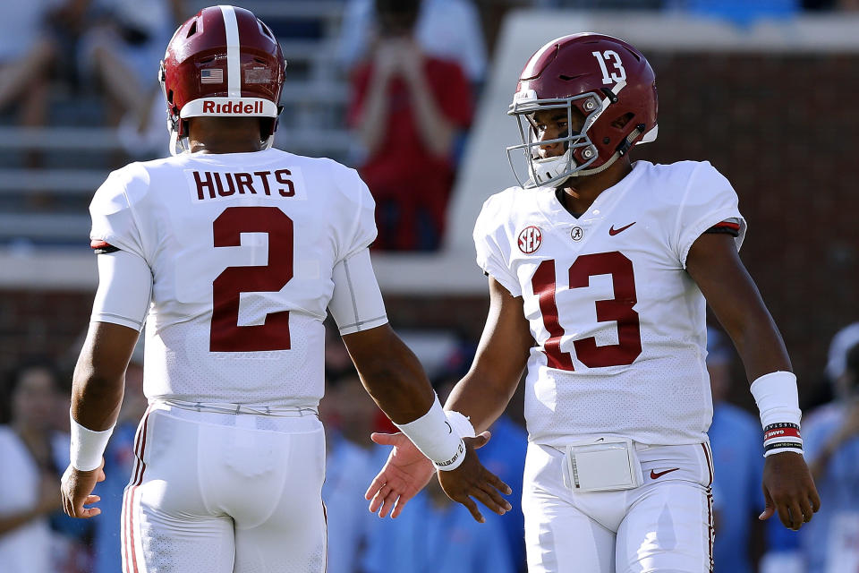 Tua Tagovailoa #13 of the Alabama Crimson Tide and Jalen Hurts #2 