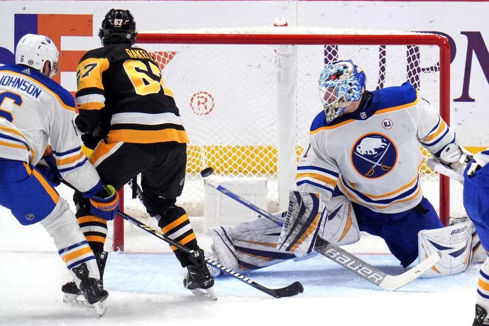 Pittsburgh Penguins' Rickard Rakell (67) gets a shot past Buffalo Sabres goaltender Ukko-Pekka Luukkonen (1) for a goal during the third period of an NHL hockey game, Saturday, Jan. 6, 2024, in Pittsburgh. The Sabres won 3-1. (AP Photo/Gene J. Puskar)